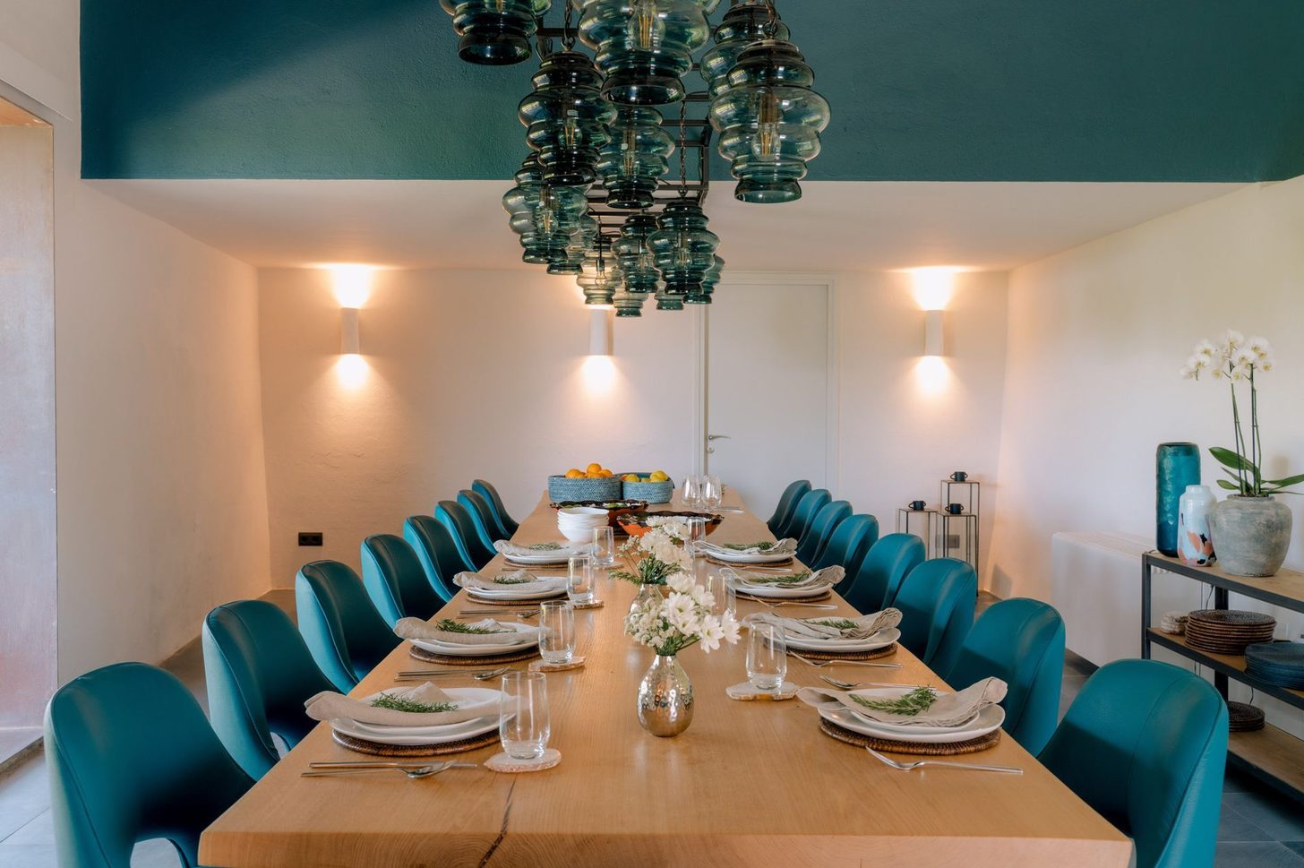 A long private dining table laid for a group
